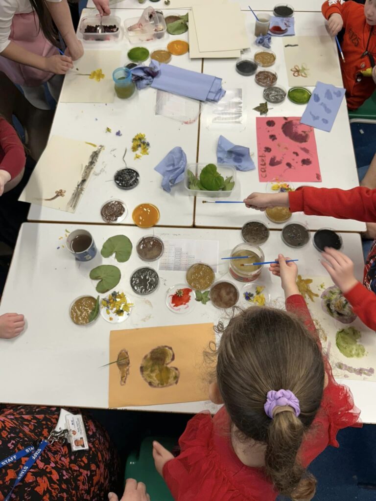 Painting and looking at leaves in the classroom