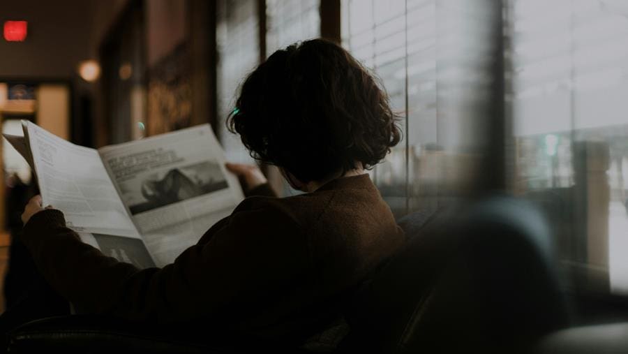 Photo of a woman reading a magazine