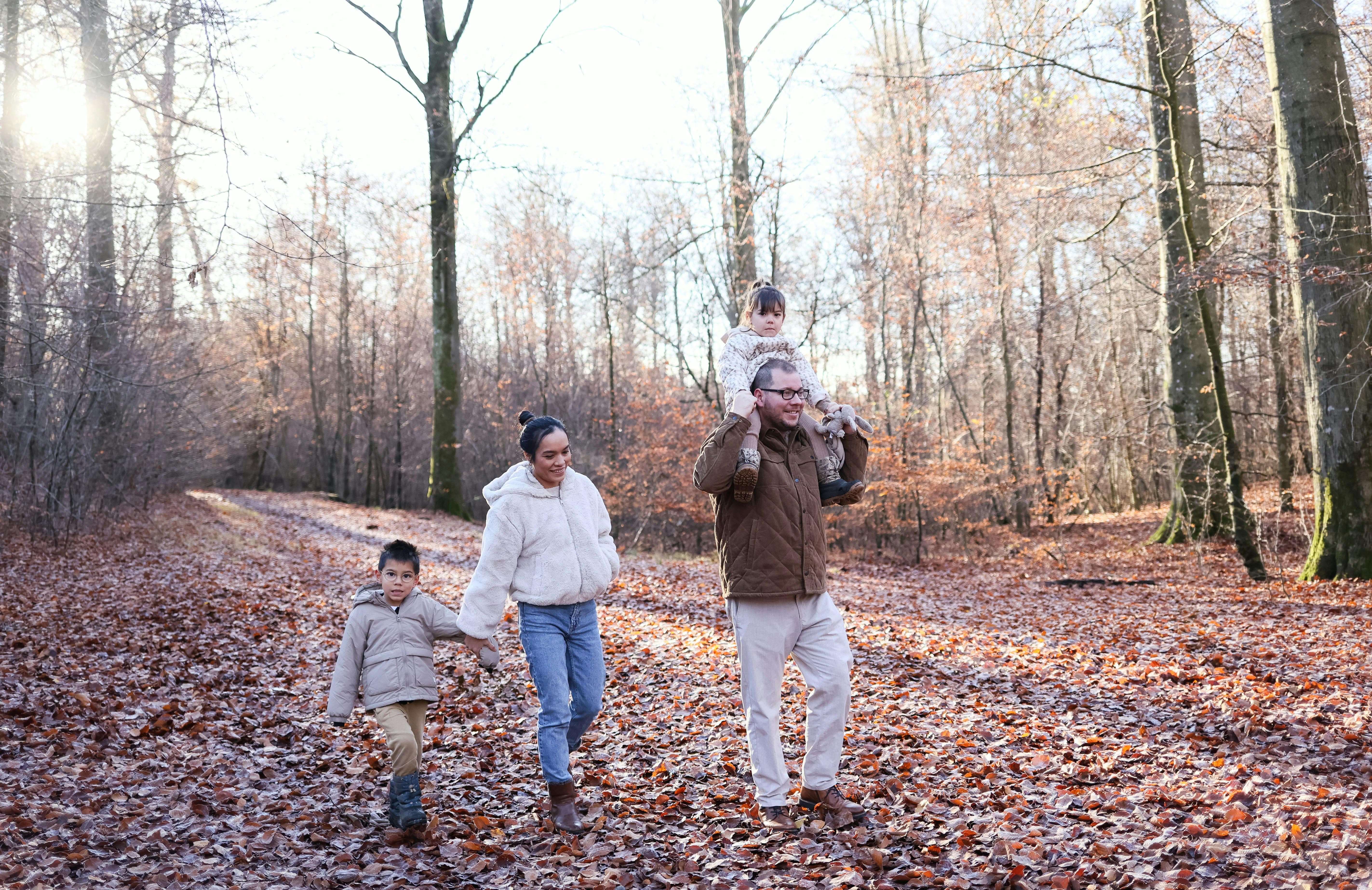 Family walking through woodland
